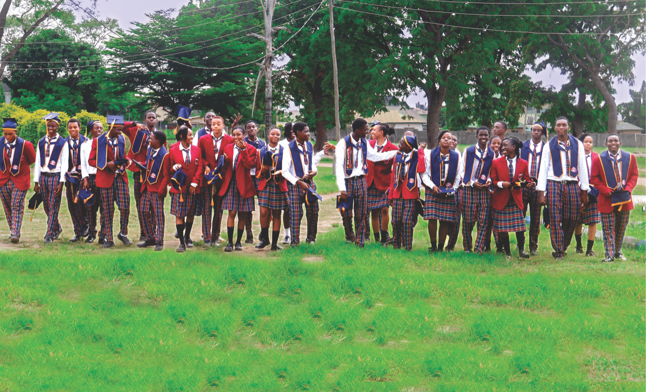 Holy Family College students celebrating together on the school field